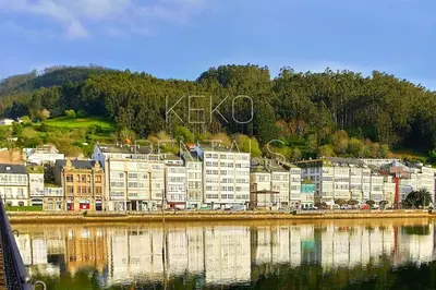 a group of buildings next to a body of water at Casa Lolita 2 in Viveiro