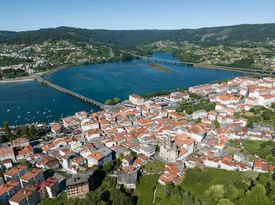 an aerial view of a town on the water at La Fantástica Pontedeume 3 in Puentedeume
