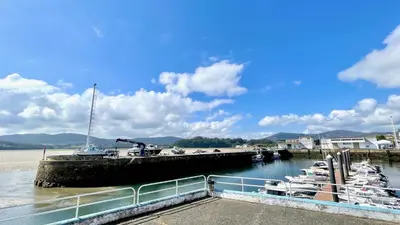 a bunch of boats docked at a dock at The Cliffs A Ribeira - Rapadoira in Foz