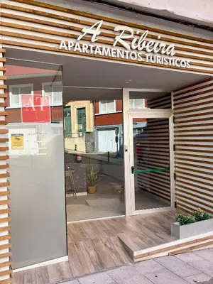 a restaurant with a sign on the front of the door at The Cliffs A Ribeira - Polas in Foz