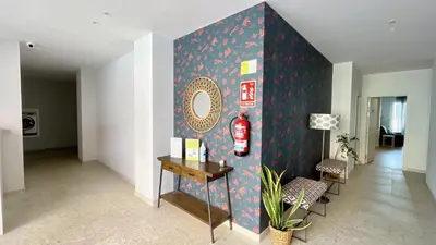 a living room with a wall with a fire extinguisher at The Cliffs A Ribeira - Areoura in Foz
