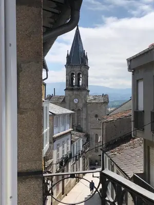 a view of a building with a clock tower at Estudios rúa Maior, 49-2B in Sarria