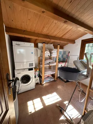 a green bedroom with two beds and a window at Apartamentos Helenias in Boal