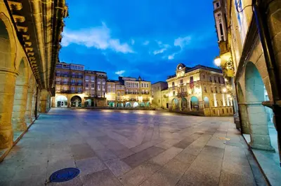 an empty street in a city at night at YourHouse Lagoa in Ourense
