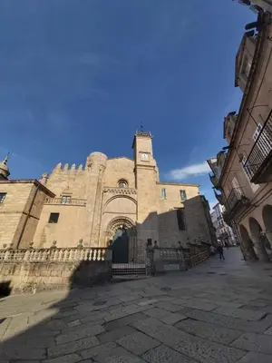 a large stone building with a clock tower on it at YourHouse Progreso 1 apartment in Ourense