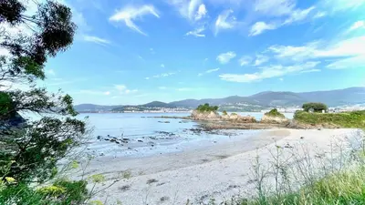a beach with a view of the ocean at The Cliffs - AT Seiramar Sacido in Viveiro