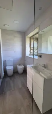 a bathroom with a toilet and a sink at Casa Escuela Sanguñedo in Magdalena