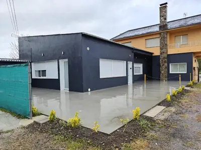 a flooded parking lot in front of a building at Lar de Yago - Apto Barreiros B in San Cosme de Barreiros