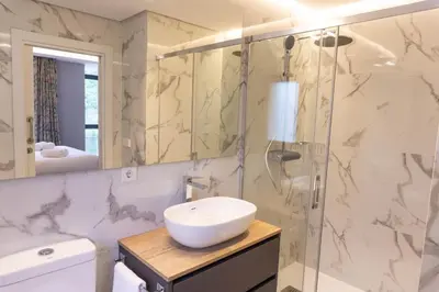 a bathroom with a sink and a shower at Albariño in Pincelo
