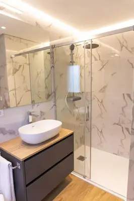 a bathroom with a sink and a shower at Albariño in Pincelo