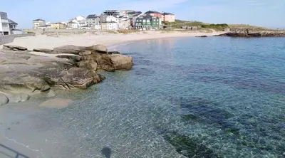 an aerial view of a beach with houses and the water at EnSAN CIPRIAN Atico en Urb Río Cobo in San Ciprián