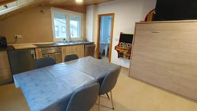 a kitchen with a table and chairs in a room at Nuestro sueño jurásico in Barreiros