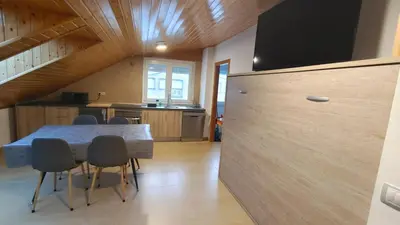 a kitchen with a table and chairs and a large wall at Nuestro sueño jurásico in Barreiros