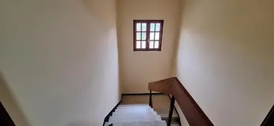 a staircase in a building with a window on the wall at Casa Julia in Barreiros