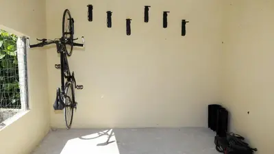 a room with a bike hanging on the wall at Hotel Montero in Mondoñedo
