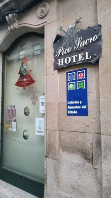 a store window with a sign for a hotel at PICO SACRO II HOTEL Santiago de Compostela in Santiago de Compostela