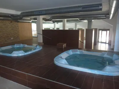two jacuzzi tubs in the middle of a room at Precioso Apartamento con Spa en Galicia / Playa Catedrales in Foz