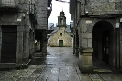 an old building with a tower and a church at Vintage Ribadavia in Ribadavia