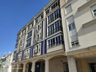 a building with a blue and white building at AURINE in Foz