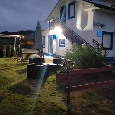 a house with a light on the side of it at Vivienda uso turistico Los Nogales in Foz