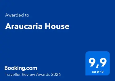 a blue screen with the text awarded to aarzona house at Araucaria House in Barreiros