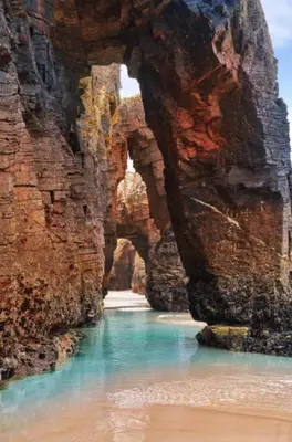 a view of a river between two large rocks at FANTASTICO APARTAMENTO EN RIBADEO in Ribadeo