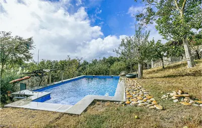 a swimming pool in the middle of a yard at Beautiful Home In Diomondi With Wifi in Diomondi