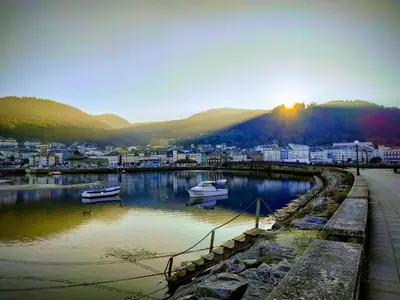 a city with boats in a body of water at Indiano 4B in Viveiro