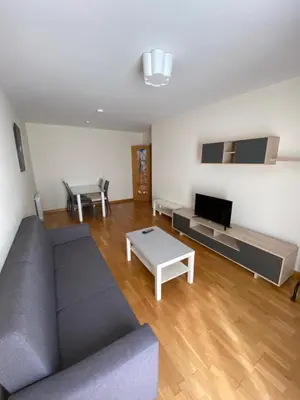 a living room with a couch and a table at dpCristal Calvo Sotelo 164, 4C in Sarria