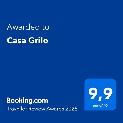 a blue text box with the text awarded to casa grila at Casa Grilo in Monforte de Lemos